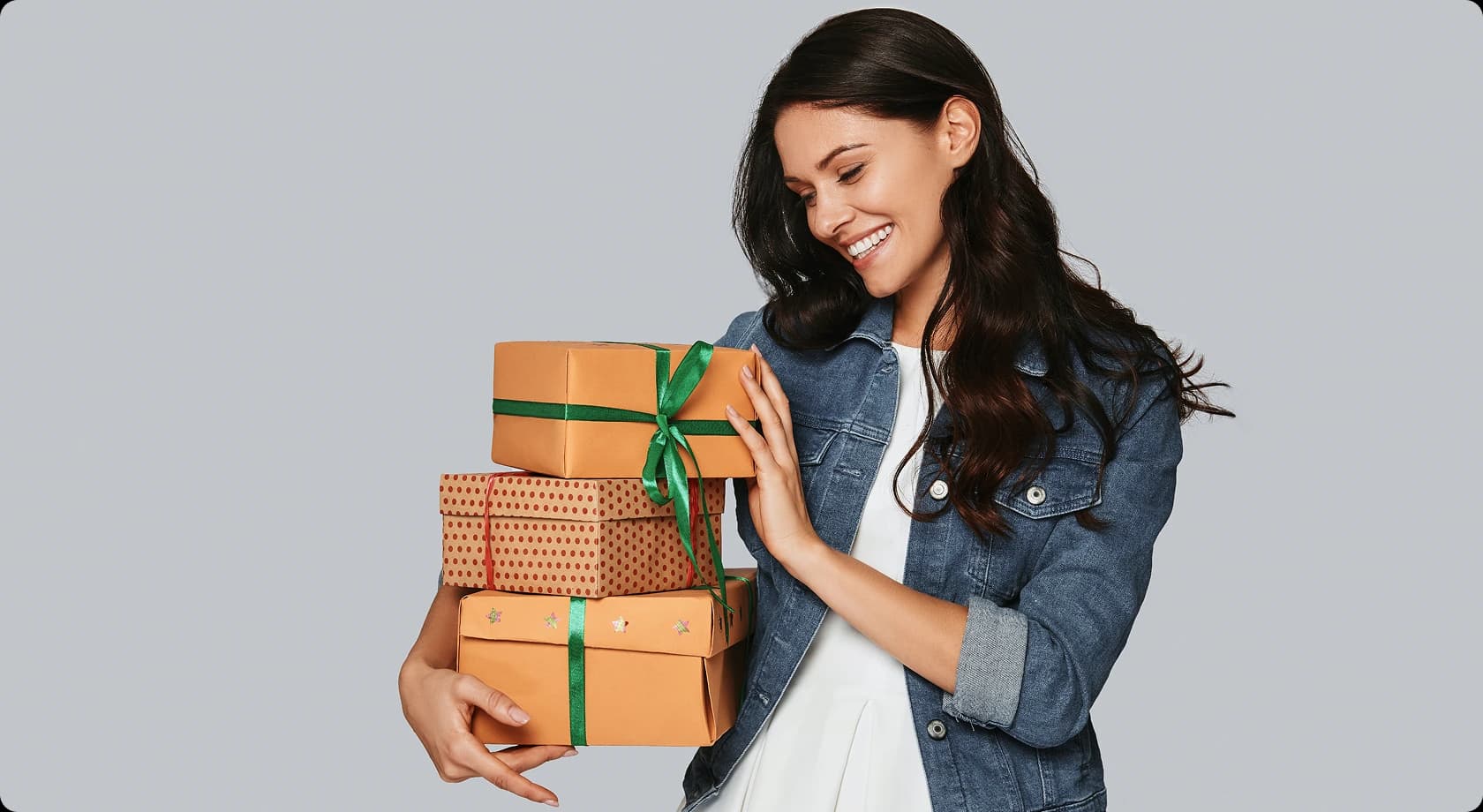 Woman holding stacked gift boxes