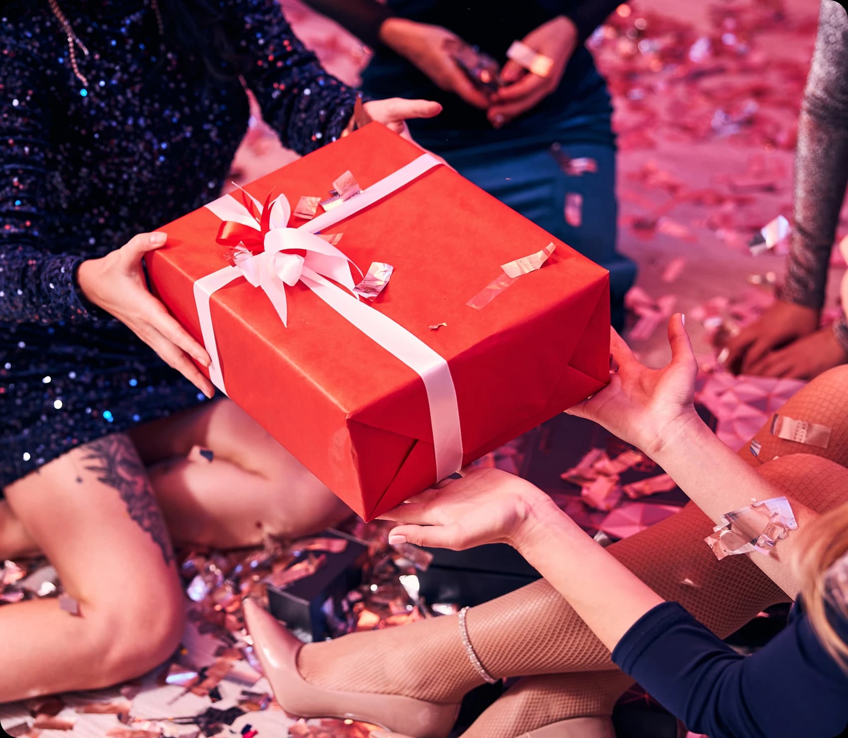 Hands opening a gift box